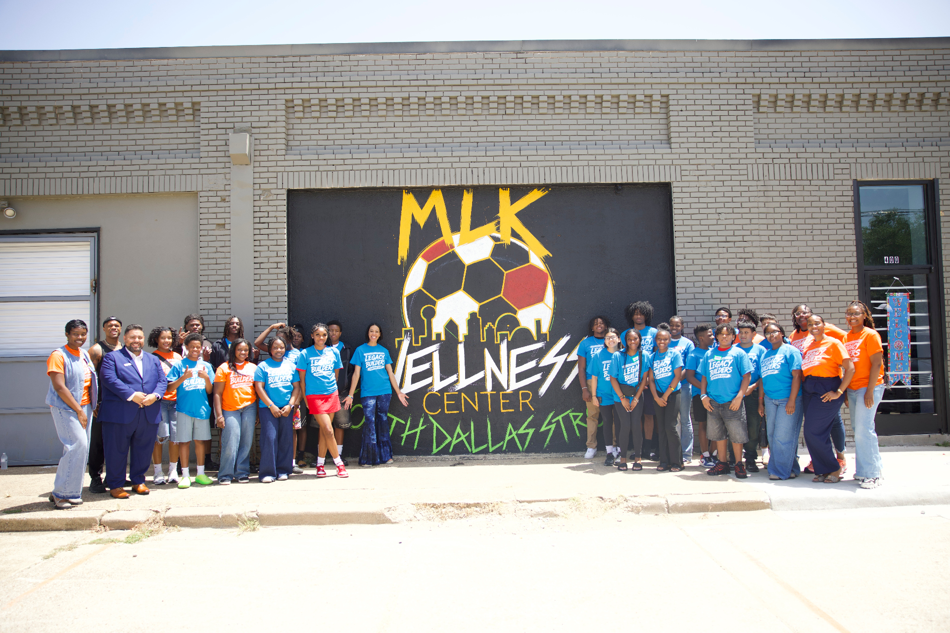 Academy students and mentors gathered outside in South Dallas